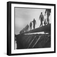 Men Laying Pipeline-null-Framed Photographic Print