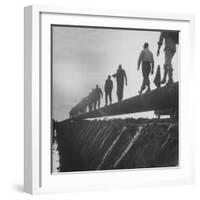 Men Laying Pipeline-null-Framed Photographic Print