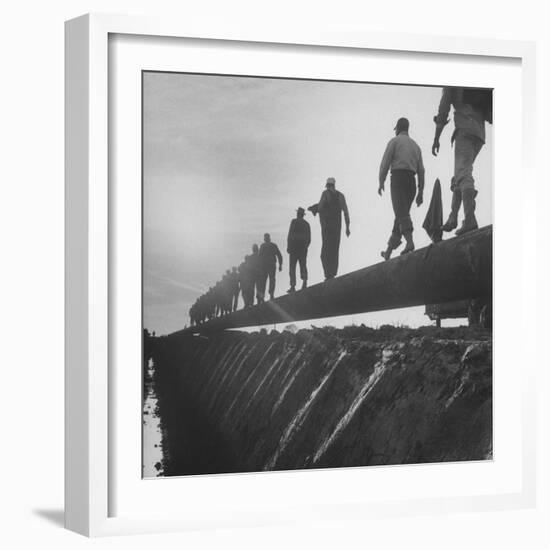 Men Laying Pipeline-null-Framed Photographic Print