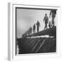 Men Laying Pipeline-null-Framed Photographic Print