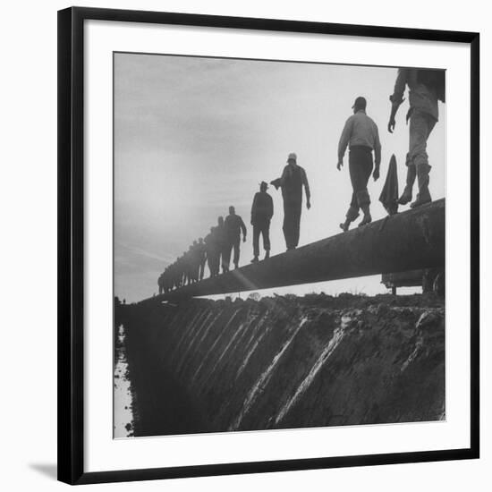 Men Laying Pipeline-null-Framed Photographic Print