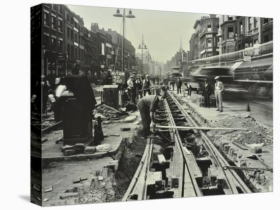 Men Laying Tramlines in the Middle of the Road, Whitechapel High Street, London, 1929-null-Stretched Canvas