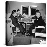 Men Playing a Card Game While Riding Aboard the Atlantic Clipper-Bernard Hoffman-Stretched Canvas