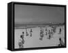 Men Playing a Game of Volleyball on the Beach-null-Framed Stretched Canvas