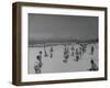 Men Playing a Game of Volleyball on the Beach-null-Framed Photographic Print