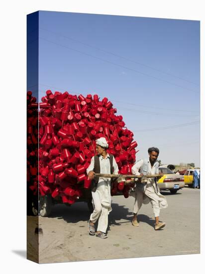 Men Pulling Wooden Cart Piled with Red Water Containers Along Road, Balkh Province, Afghanistan-Jane Sweeney-Stretched Canvas