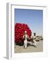 Men Pulling Wooden Cart Piled with Red Water Containers Along Road, Balkh Province, Afghanistan-Jane Sweeney-Framed Photographic Print