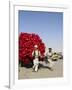 Men Pulling Wooden Cart Piled with Red Water Containers Along Road, Balkh Province, Afghanistan-Jane Sweeney-Framed Photographic Print