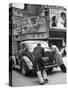 Men Pushing a Car Up a Street, Bilboards Overhead-Carl Mydans-Stretched Canvas