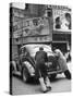 Men Pushing a Car Up a Street, Bilboards Overhead-Carl Mydans-Stretched Canvas