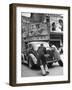 Men Pushing a Car Up a Street, Bilboards Overhead-Carl Mydans-Framed Photographic Print