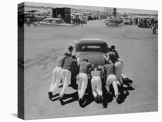 Men Pushing Car During Nat. Hot Rod Assoc. Drag Meet-Ralph Crane-Stretched Canvas