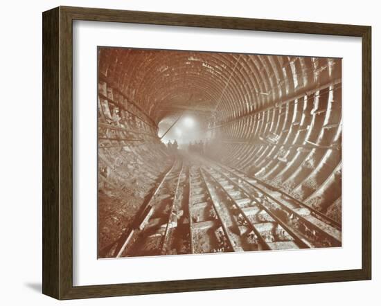 Men Pushing Railway Trucks Along the Rotherhithe Tunnel, Stepney, London, June 1907-null-Framed Premium Photographic Print