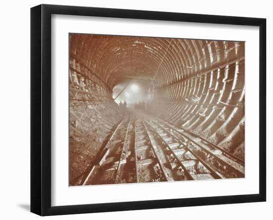 Men Pushing Railway Trucks Along the Rotherhithe Tunnel, Stepney, London, June 1907-null-Framed Premium Photographic Print