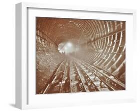 Men Pushing Railway Trucks Along the Rotherhithe Tunnel, Stepney, London, June 1907-null-Framed Premium Photographic Print