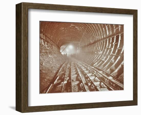 Men Pushing Railway Trucks Along the Rotherhithe Tunnel, Stepney, London, June 1907-null-Framed Photographic Print