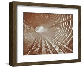 Men Pushing Railway Trucks Along the Rotherhithe Tunnel, Stepney, London, June 1907-null-Framed Photographic Print