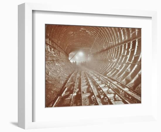 Men Pushing Railway Trucks Along the Rotherhithe Tunnel, Stepney, London, June 1907-null-Framed Photographic Print