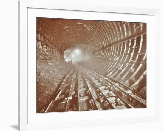 Men Pushing Railway Trucks Along the Rotherhithe Tunnel, Stepney, London, June 1907-null-Framed Photographic Print