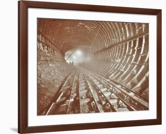 Men Pushing Railway Trucks Along the Rotherhithe Tunnel, Stepney, London, June 1907-null-Framed Photographic Print