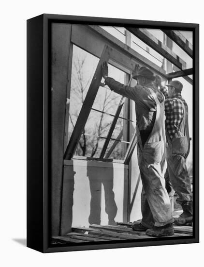 Men Putting Windows In-null-Framed Stretched Canvas