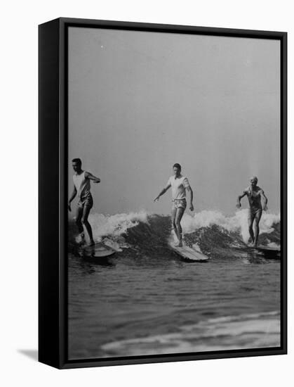 Men Riding the Waves on Surf Boards-null-Framed Stretched Canvas
