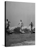 Men Riding the Waves on Surf Boards-null-Stretched Canvas