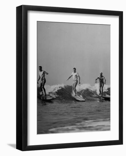 Men Riding the Waves on Surf Boards-null-Framed Photographic Print