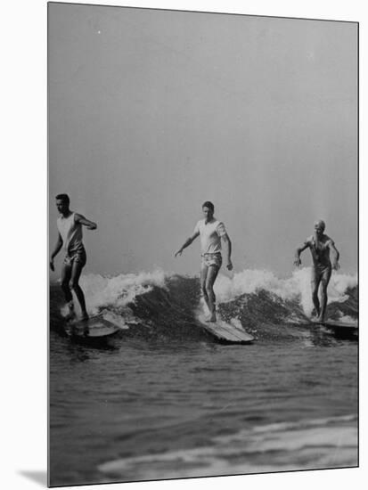 Men Riding the Waves on Surf Boards-null-Mounted Photographic Print