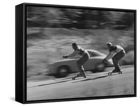 Men Roller Skiing in the Streets-null-Framed Stretched Canvas