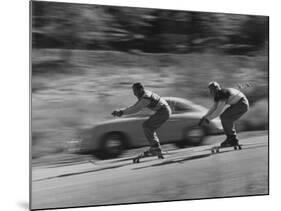 Men Roller Skiing in the Streets-null-Mounted Photographic Print