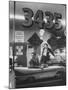 Men Standing in the Window of a Car Dealership-Francis Miller-Mounted Photographic Print