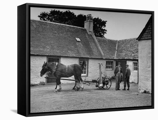 Men Standing Near Horse-Drawn Farming Equipment-null-Framed Stretched Canvas