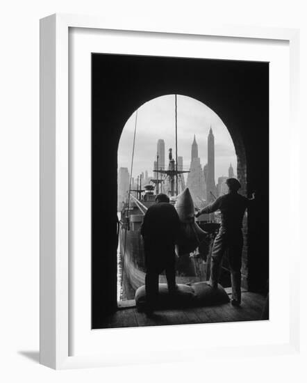 Men Unloading Coffee at Brooklyn Dock. View of Downtown Manhattan in Background-Andreas Feininger-Framed Photographic Print