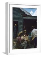 Men Watch Three Young Women Pluck Feathers from Chickenss, Edisto Island, South Carolina, 1956-Walter Sanders-Framed Photographic Print