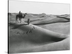 Men with Camel Traveling the Sahara Desert-null-Stretched Canvas