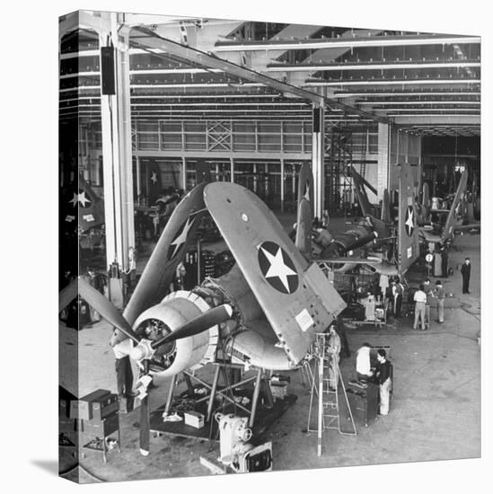 Men Working on the Aircrafts Final Constructing Stages-Peter Stackpole-Stretched Canvas