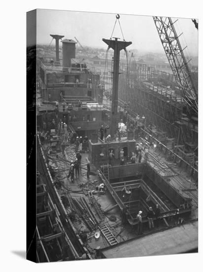 Men Working on the Liberty Ship in the Kaiser Shipyard-Hansel Mieth-Stretched Canvas