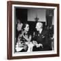 Merle Oberon and Walter Winchell Chatting at the Stork Club-null-Framed Photographic Print