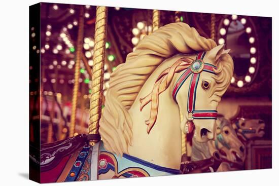 Merry-Go-Round Wooden Horses Toned with a Retro Vintage Instagram Filter Effect-graphicphoto-Stretched Canvas
