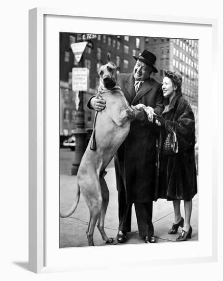 Metropolitan Opera's Helden Tenor Lauritz Melchior with Wife, Petting His Great Dane Dog on Street-Nina Leen-Framed Premium Photographic Print