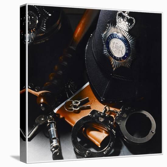 Metropolitan Police Equipment Including a Helmet, Handcuffs, Whistle, Keys and Truncheon-null-Stretched Canvas