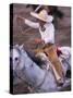 Mexico, Jalisco, Puerto Vallarta Cowboy attempts to rope a bull at the charro, rodeo-Merrill Images-Stretched Canvas