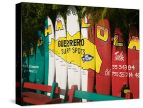 Mexico, Pacific Coast, Guerrero, Ixtapa, Catcha La Ola Surf Shop Sign-Walter Bibikow-Stretched Canvas