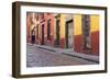 Mexico, San Miguel de Allende. Elderly man walks up sidewalk.-Don Paulson-Framed Photographic Print