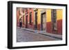 Mexico, San Miguel de Allende. Elderly man walks up sidewalk.-Don Paulson-Framed Photographic Print