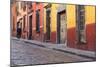 Mexico, San Miguel de Allende. Elderly man walks up sidewalk.-Don Paulson-Mounted Photographic Print