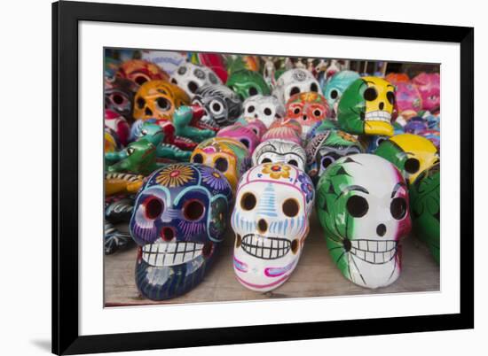 Mexico, Yucatan, Isla Mujeres, colorful ceramic calavera skulls for sale in market.-Merrill Images-Framed Photographic Print