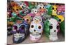 Mexico, Yucatan, Isla Mujeres, colorful ceramic calavera skulls for sale in market.-Merrill Images-Mounted Photographic Print