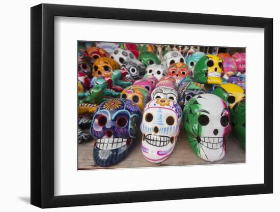 Mexico, Yucatan, Isla Mujeres, colorful ceramic calavera skulls for sale in market.-Merrill Images-Framed Photographic Print